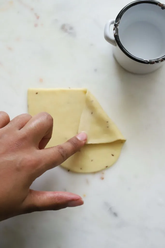 Folding homemade samosa