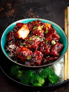 General Tso Paneer in a bowl with rice and broccoli