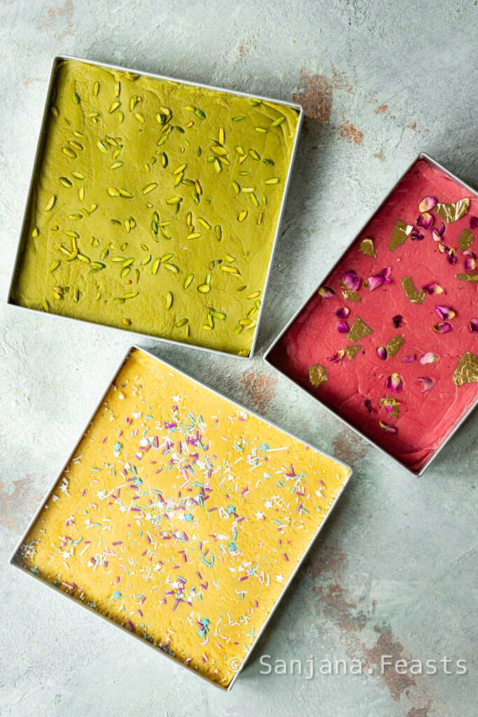 different flavours of barfi setting in trays