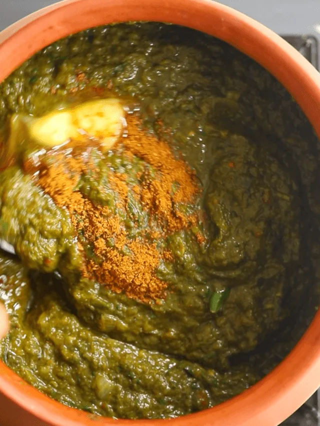 Finish sarson ka saag with butter and garam masala