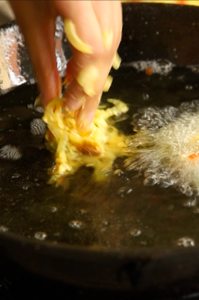 Frying onion bhaji