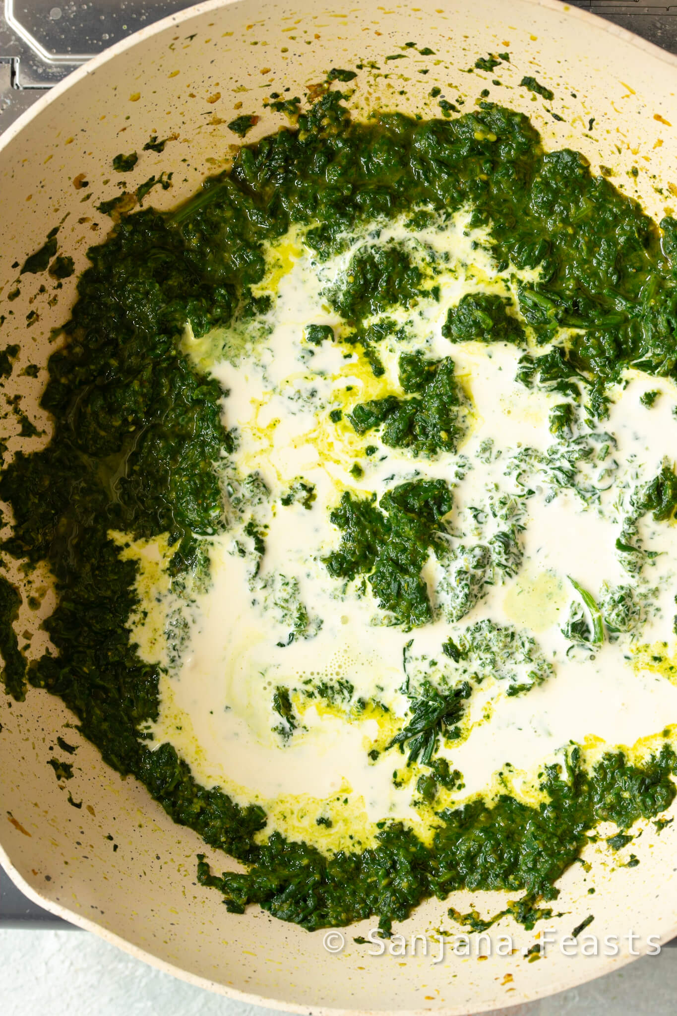 add cream to the spinach mixture