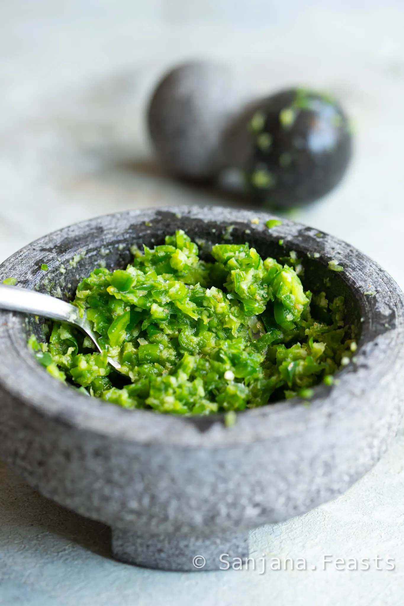 make a coarse spice paste with garlic ginger and green pepper