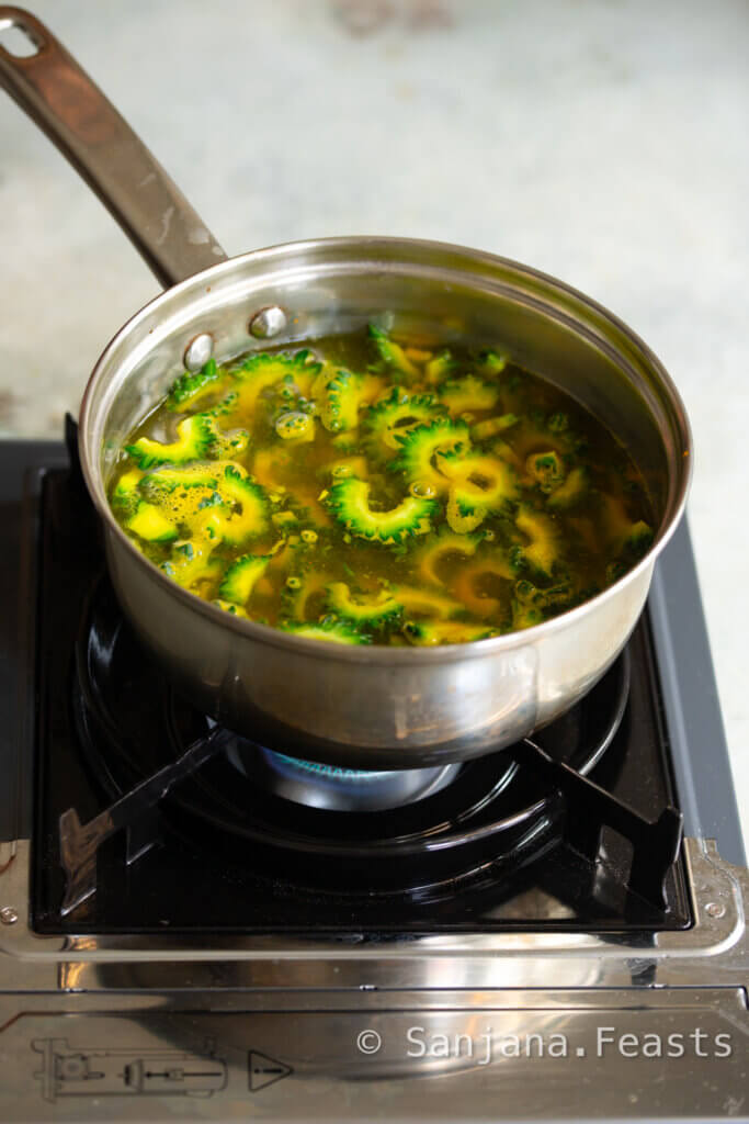 Boil the karela with turmeric