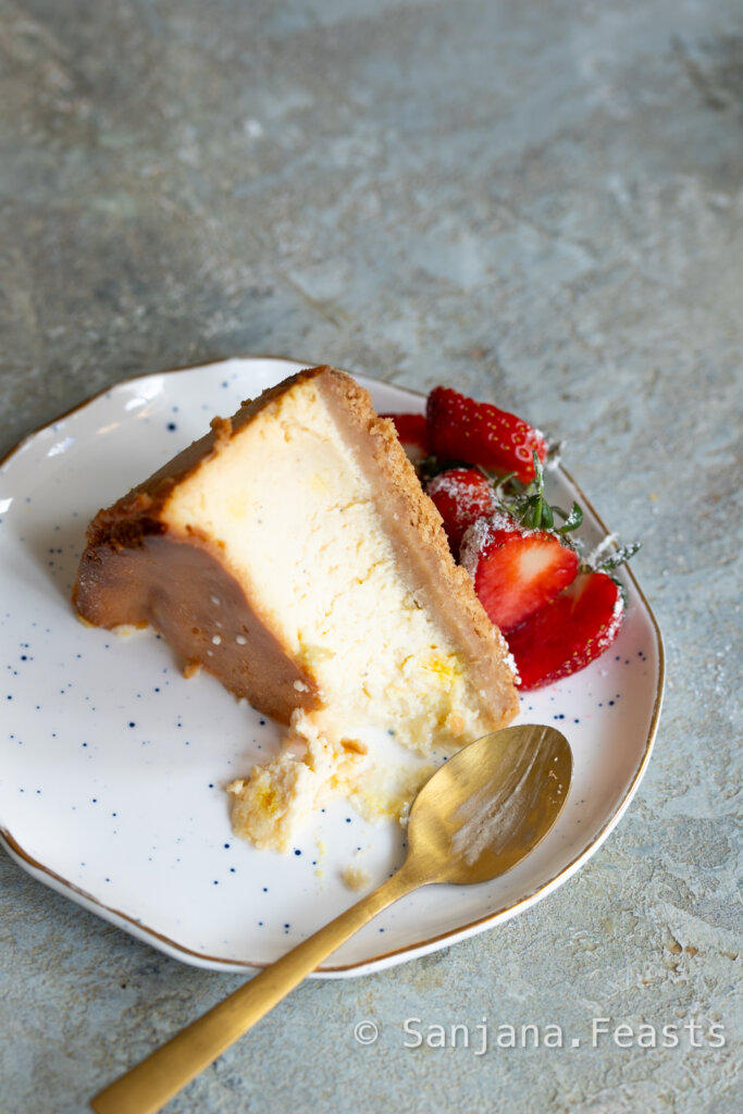 Slice of shrikhand cheesecake on plate